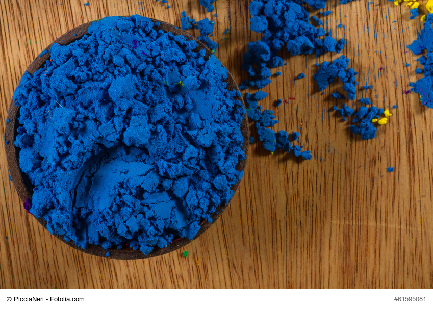 Colorful, finely powdered Indian pigments.Focus on blue. Copy space.